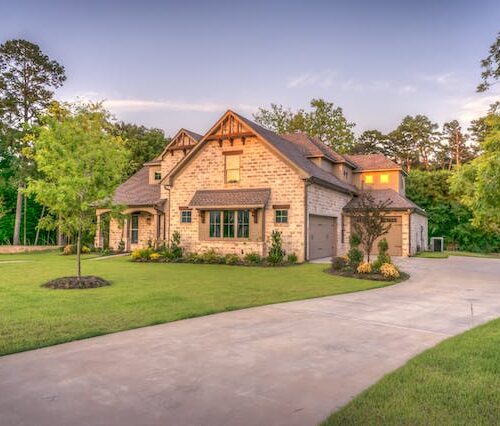 louisiana home with well-pruned trees in yard